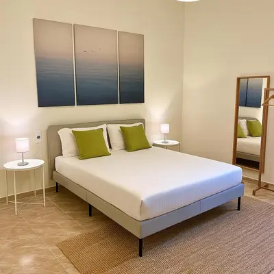 Letto o letti in una camera di Appartamento in Siracusa Centro- Dimora Eucleide