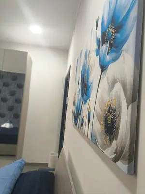 Letto o letti in una camera di Blue Flowers Room