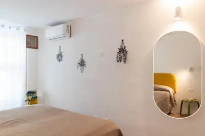 Letto o letti in una camera di Dimora Netina by Wonderful Italy