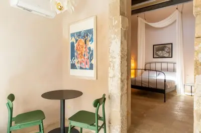 Letto o letti in una camera di Charming Nest with Terrace by Wonderful Italy