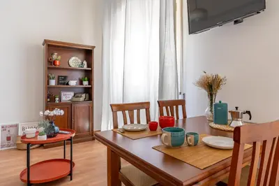 Area soggiorno di Ierone Apartment with Balcony by Wonderful Italy