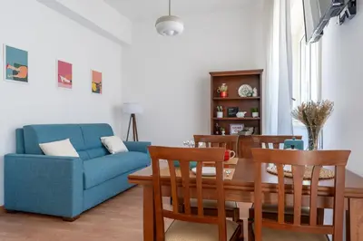 Area soggiorno di Ierone Apartment with Balcony by Wonderful Italy