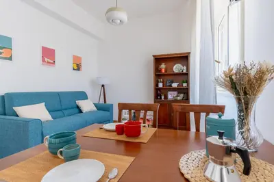 Area soggiorno di Ierone Apartment with Balcony by Wonderful Italy
