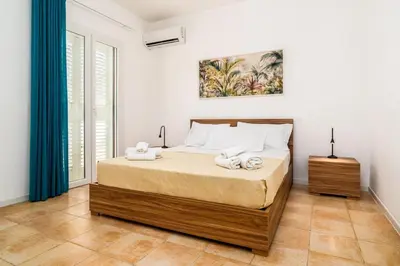 Letto o letti in una camera di Sea Residence LUNA ROSSA