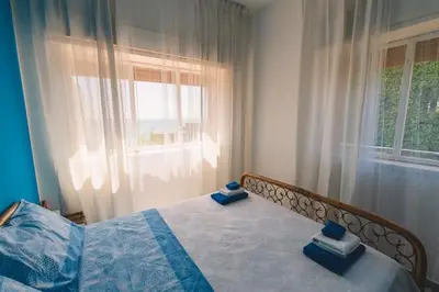 Letto o letti in una camera di La finestra sul mare di villa Fiorella