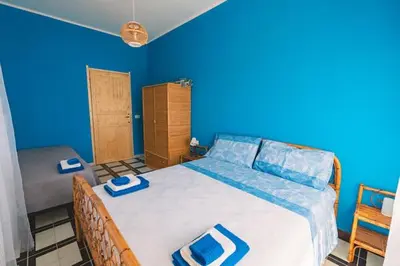 Letto o letti in una camera di La finestra sul mare di villa Fiorella