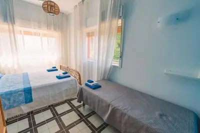 Letto o letti in una camera di La finestra sul mare di villa Fiorella