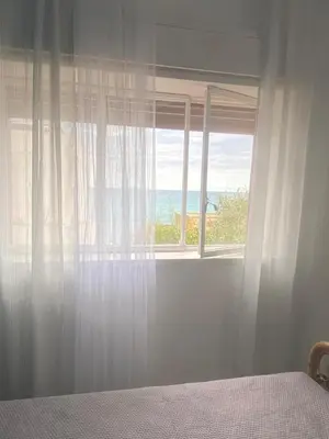 Letto o letti in una camera di La finestra sul mare di villa Fiorella