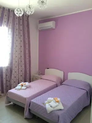 Letto o letti in una camera di B&B Giorgio La Pira
