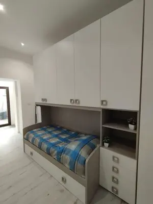 Letto o letti in una camera di Casa Orchidea - Comfort minimal nel cuore di Palazzolo Acreide