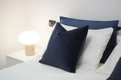 Letto o letti in una camera di Casa Cavour by Propertize - centro storico