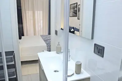 Letto o letti in una camera di Casa Cavour by Propertize - centro storico