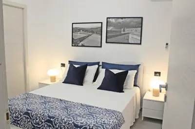Letto o letti in una camera di Casa Cavour by Propertize - centro storico