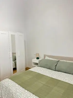 Letto o letti in una camera di Casa Garibaldi