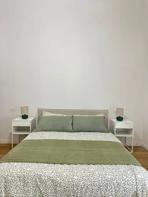 Letto o letti in una camera di Casa Garibaldi