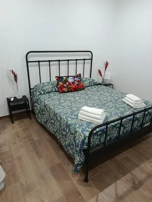 Letto o letti in una camera di Garibaldi Palace