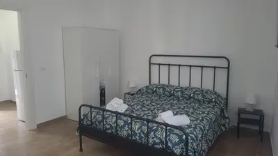 Letto o letti in una camera di Garibaldi Palace