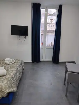 Letto o letti in una camera di Garibaldi Palace