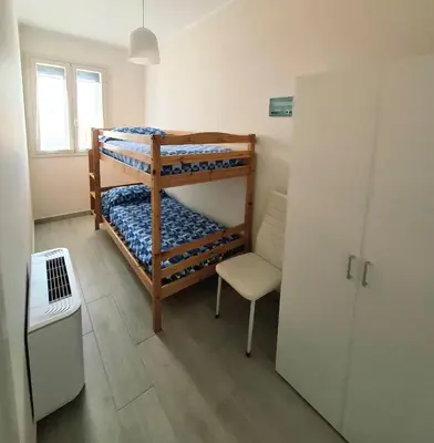 Letto o letti in una camera di HOLYDAY HOUSES Il CARRUBO
