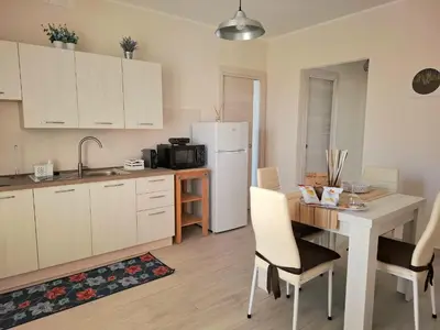 Cucina o angolo cottura di HOLYDAY HOUSES Il CARRUBO