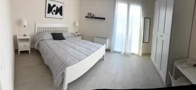 Letto o letti in una camera di HOLYDAY HOUSES Il CARRUBO