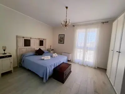 Letto o letti in una camera di HOLYDAY HOUSES Il CARRUBO