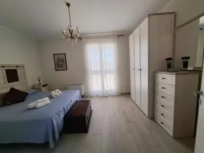 Letto o letti in una camera di HOLYDAY HOUSES Il CARRUBO