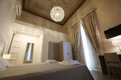 Letto o letti in una camera di B&B Elios Rooms