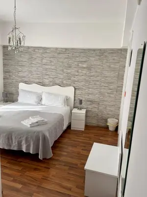 Letto o letti in una camera di B&B Elios Rooms