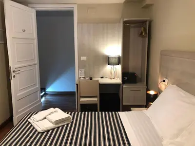 Letto o letti in una camera di B&B Elios Rooms