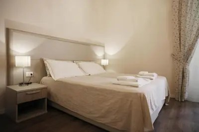 Letto o letti in una camera di B&B Elios Rooms