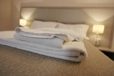 Letto o letti in una camera di B&B Elios Rooms
