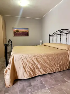 Letto o letti in una camera di varcOrtigia Bed and Breakfast
