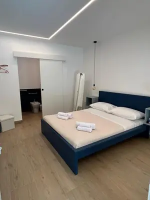 Letto o letti in una camera di AZ rooms
