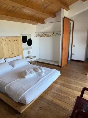 Letto o letti in una camera di Stanza panoramica Vento di Levante