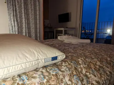 Letto o letti in una camera di Stanza panoramica Vento di Levante