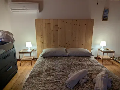 Letto o letti in una camera di Stanza panoramica Vento di Levante
