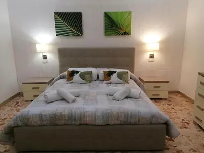 Letto o letti in una camera di Gioele House