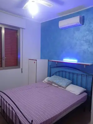 Letto o letti in una camera di Villetta FlamingoBeach Morghella