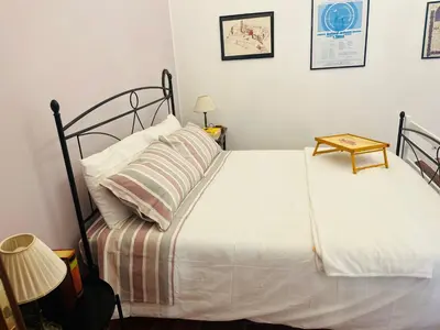 Letto o letti in una camera di Casa Vittoria