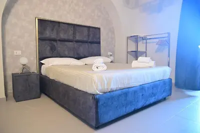 Letto o letti in una camera di B&B del Porto Catania