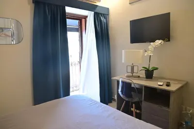 Letto o letti in una camera di B&B del Porto Catania