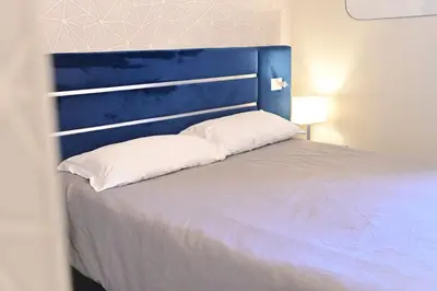 Letto o letti in una camera di B&B del Porto Catania