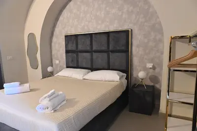 Letto o letti in una camera di B&B del Porto Catania