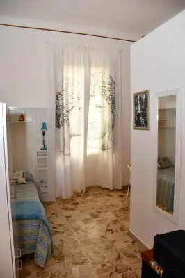 Letto o letti in una camera di Soffio del Libeccio B&B