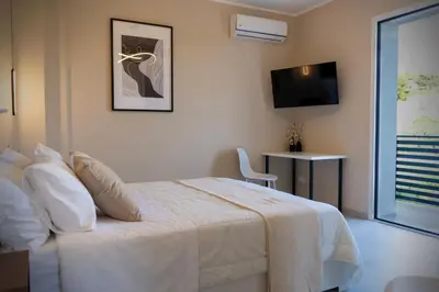 Letto o letti in una camera di Coffitella Living - Villetta indipendente con giardino e vista panoramica