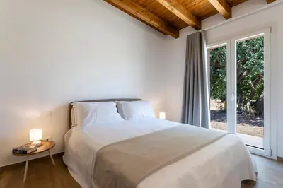 Letto o letti in una camera di ISULATRAVEL- Panoramic Relax Lodges