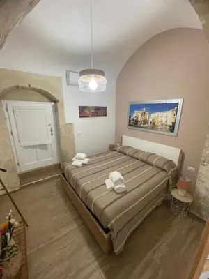 Letto o letti in una camera di Casa Ortigia KATY