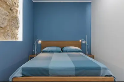 Letto o letti in una camera di casa vacanze eumelo