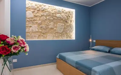 Letto o letti in una camera di casa vacanze eumelo